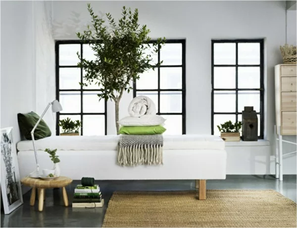 skandinavisch einrichten schlafzimmer bett rattan teppich zimmerpflanzen skandinavisches design