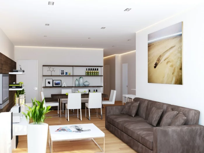 innendesign wohnzimmer weiße wandfarbe dunkles sofa pflanzen