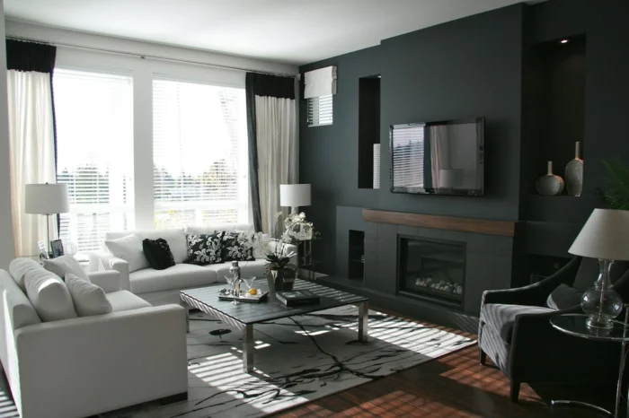 wände gestalten schwarze akzentwand schöner teppich weiße wohnzimmermöbel