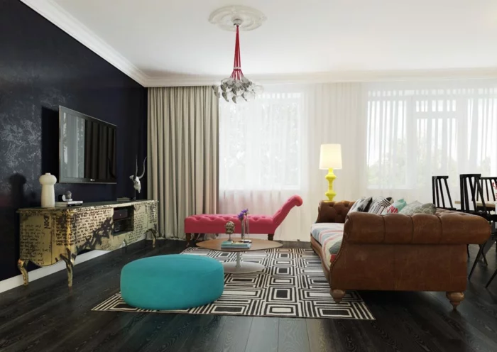chesterfield sofa modern braun teppichmuster schwarze akzentwand wohnzimmer