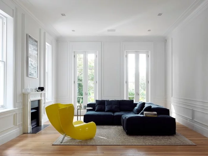 minimalistisch wohnen elegantes ecksofa gelber sessel