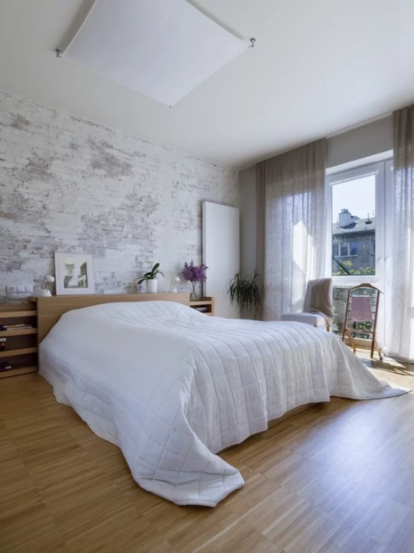 Backsteinwand im Schlafzimmer moderne Gestaltung weiß grau Holz